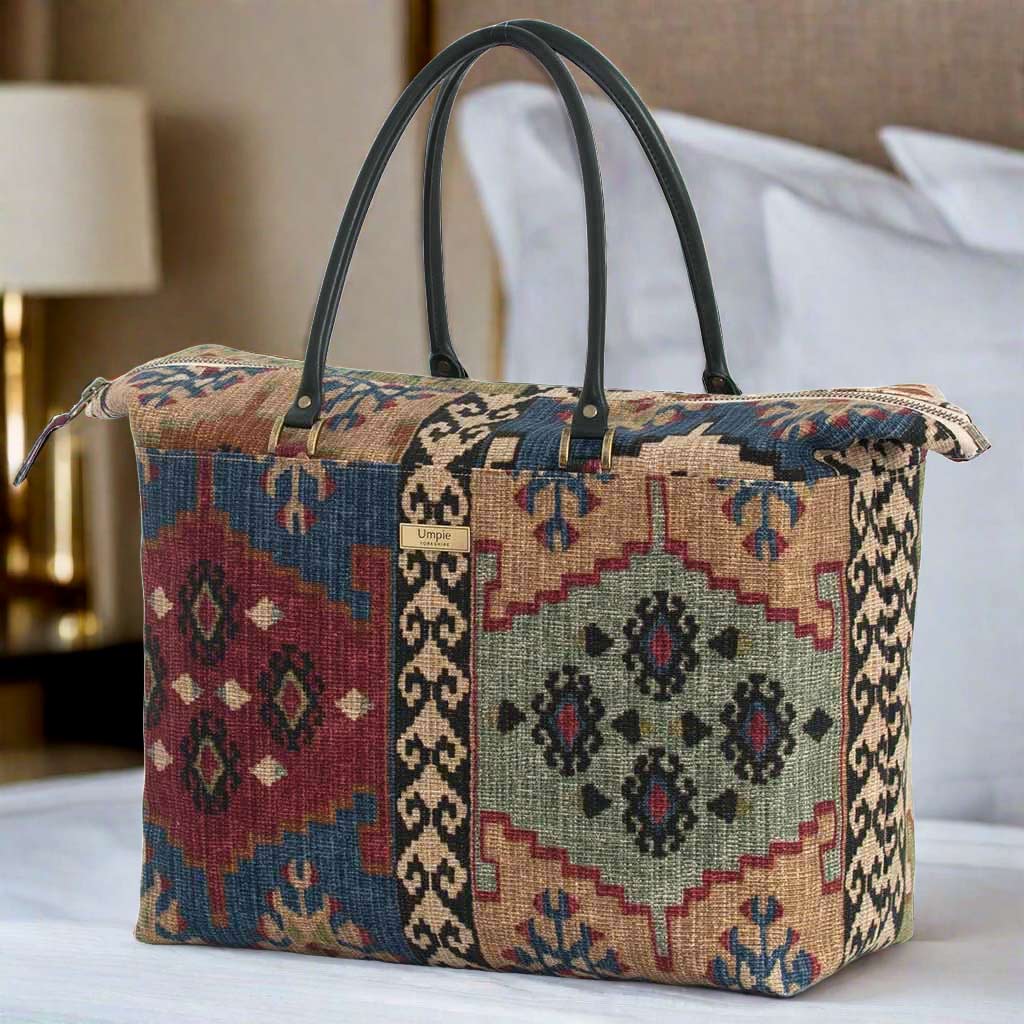 The Kilim Weekend Bag with black leather handles
