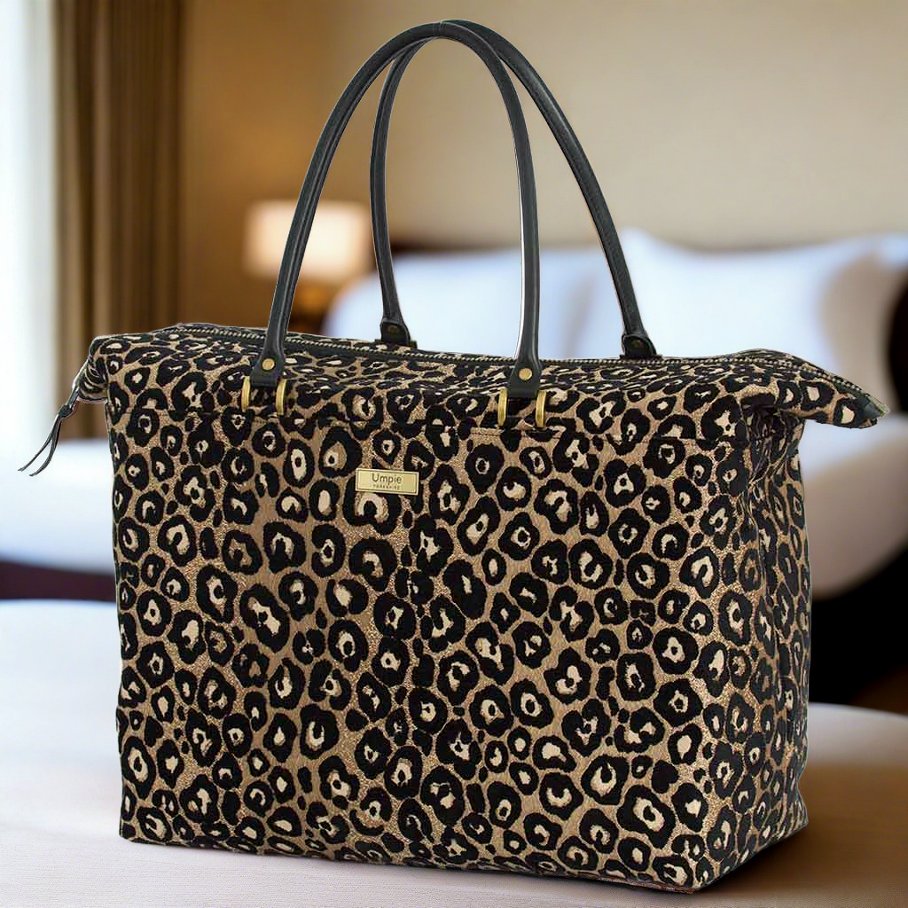 The Leopard Weekend Bag with black leather handles