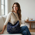 Art Deco Hobo Bag worn on shoulder showing sumptuous velvet with geometric pattern and black leather strap by Umpie Handbags

