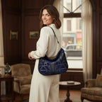 Art Deco Hobo Bag worn on shoulder showing sumptuous velvet with geometric pattern and black leather strap by Umpie Handbags

