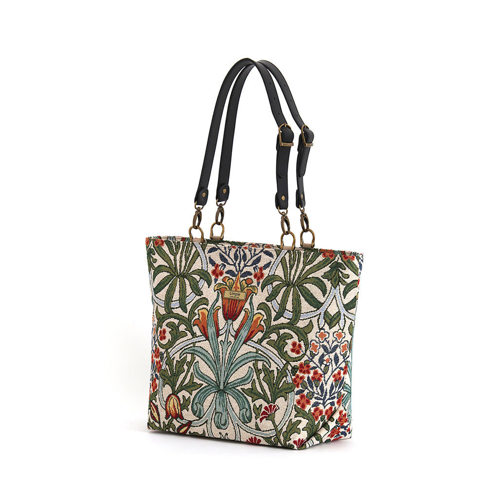 Arts & Crafts tapestry shoulder bag on white background, spacious structured silhouette with black leather straps, handcrafted in Great Britain by Umpie Handbags