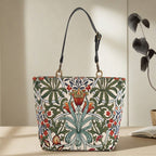 Front view of William Morris Arts & Crafts tote bag, intricate botanical tapestry fabric in warm earthy tones with premium black leather straps, by Umpie Handbags