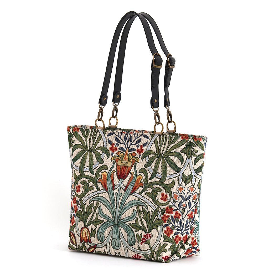 Arts & Crafts tapestry tote bag on white background, spacious structured silhouette with black leather straps, handcrafted in Great Britain by Umpie Handbags
