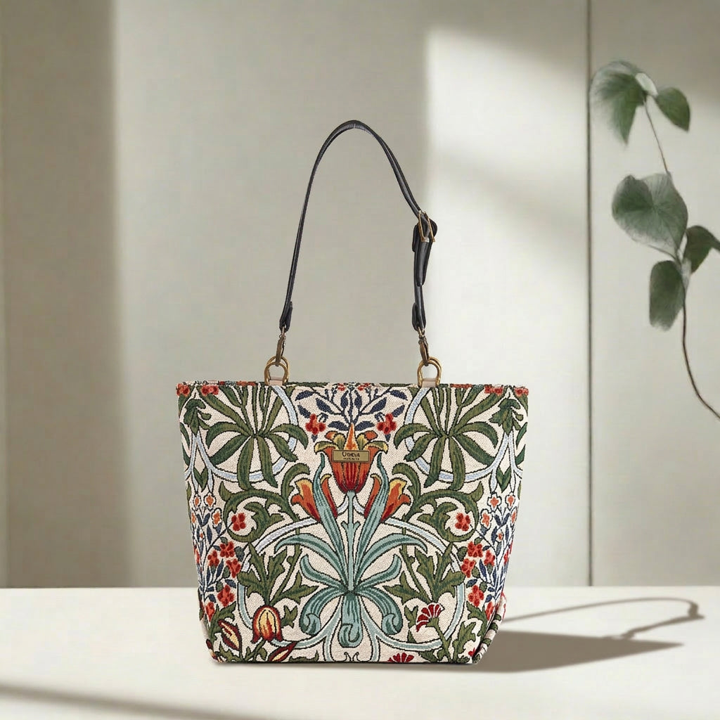 William Morris Arts & Crafts tapestry tote bag on white background, spacious structured silhouette with black leather straps, handcrafted in Great Britain by Umpie Handbags
