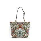 Arts & Crafts tapestry shoulder bag on white background, spacious structured silhouette with black leather straps, handcrafted in Great Britain by Umpie Handbags
