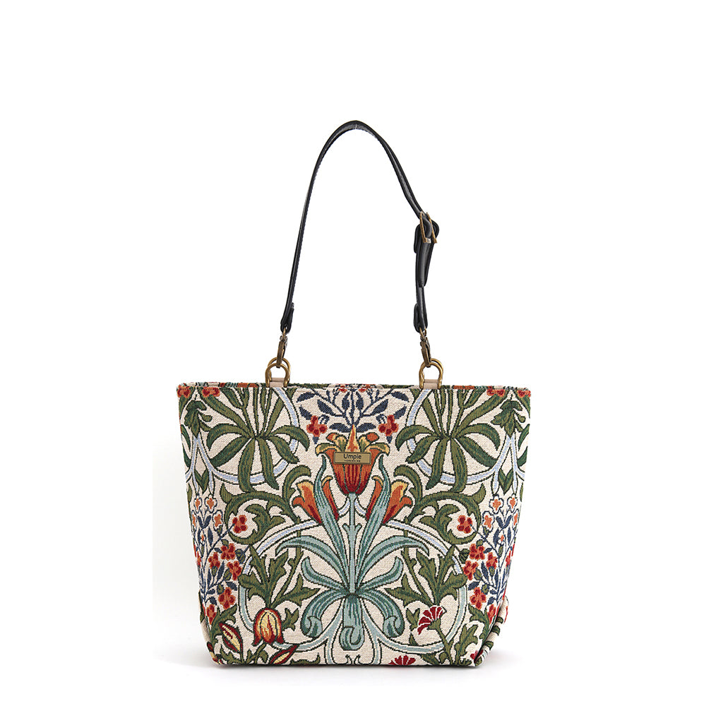 Arts & Crafts tapestry shoulder bag on white background, spacious structured silhouette with black leather straps, handcrafted in Great Britain by Umpie Handbags
