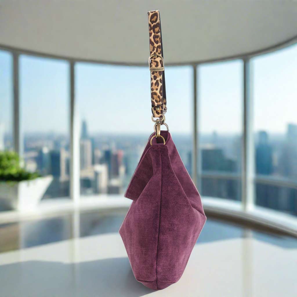 The Aubergine Velvet Hobo Bag with a leopard print strap - side view