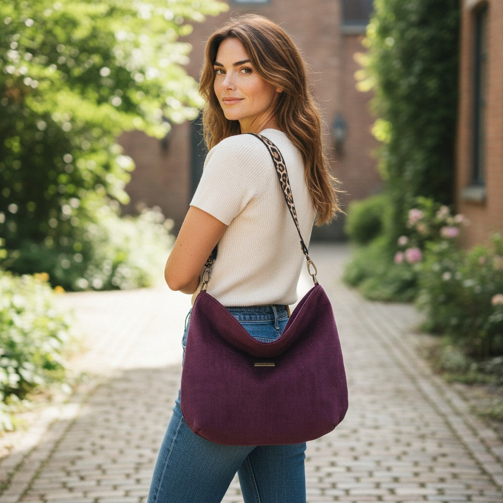 Luxurios Aubergine velvet hobo bag with bold leopard print leather strap, front view showing rich texture and slouchy silhouette by Umpie Handbags