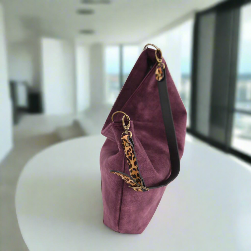 The Aubergine Velvet Hobo Bag with a leopard print leather strap