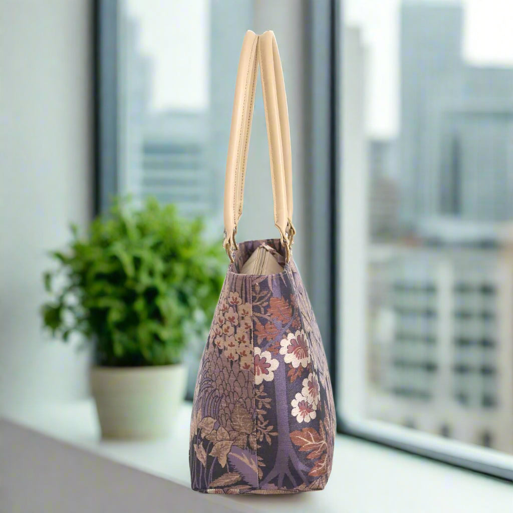 Side profile of Purple Brocade Shoulder Bag displaying elegant silhouette and protective metal feet by Umpie Handbags