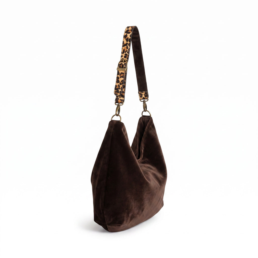 Side view of the brown velvet hobo bag showing the generous slouchy silhouette and matching leopard print strap by Umpie Handbags