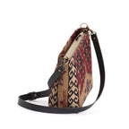 The top-zip view of Kilim canvas crossbody bag with green and wine geometric pattern handmade in Great Britain by Umpie Handbags