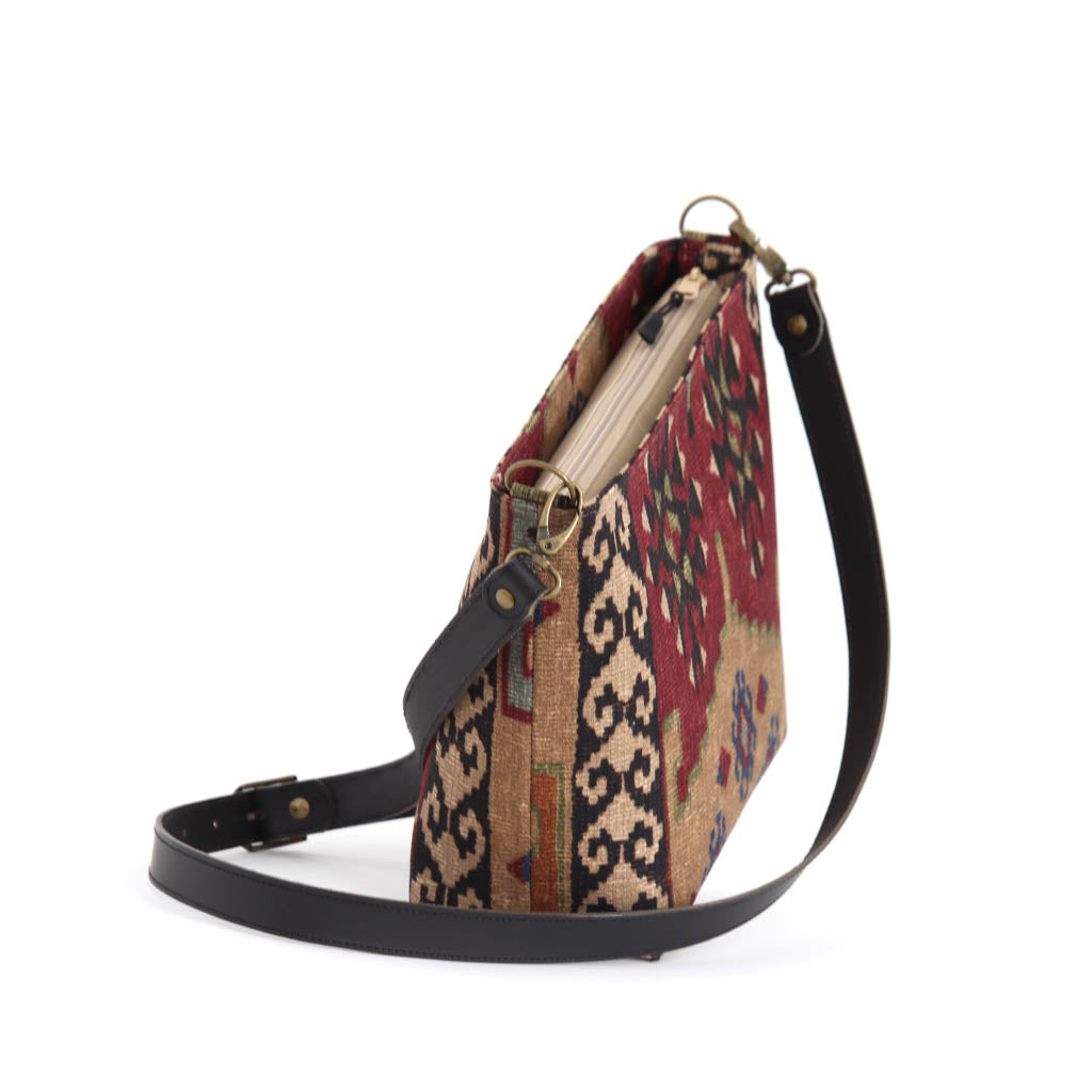 The top-zip view of Kilim canvas crossbody bag with green and wine geometric pattern handmade in Great Britain by Umpie Handbags