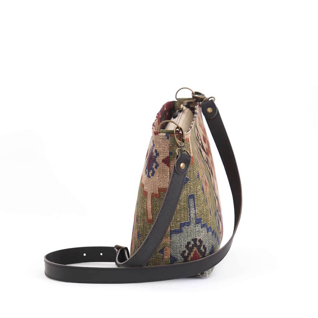 Side view of Kilim canvas crossbody bag with navy and green geometric pattern handmade in Great Britain by Umpie Handbags