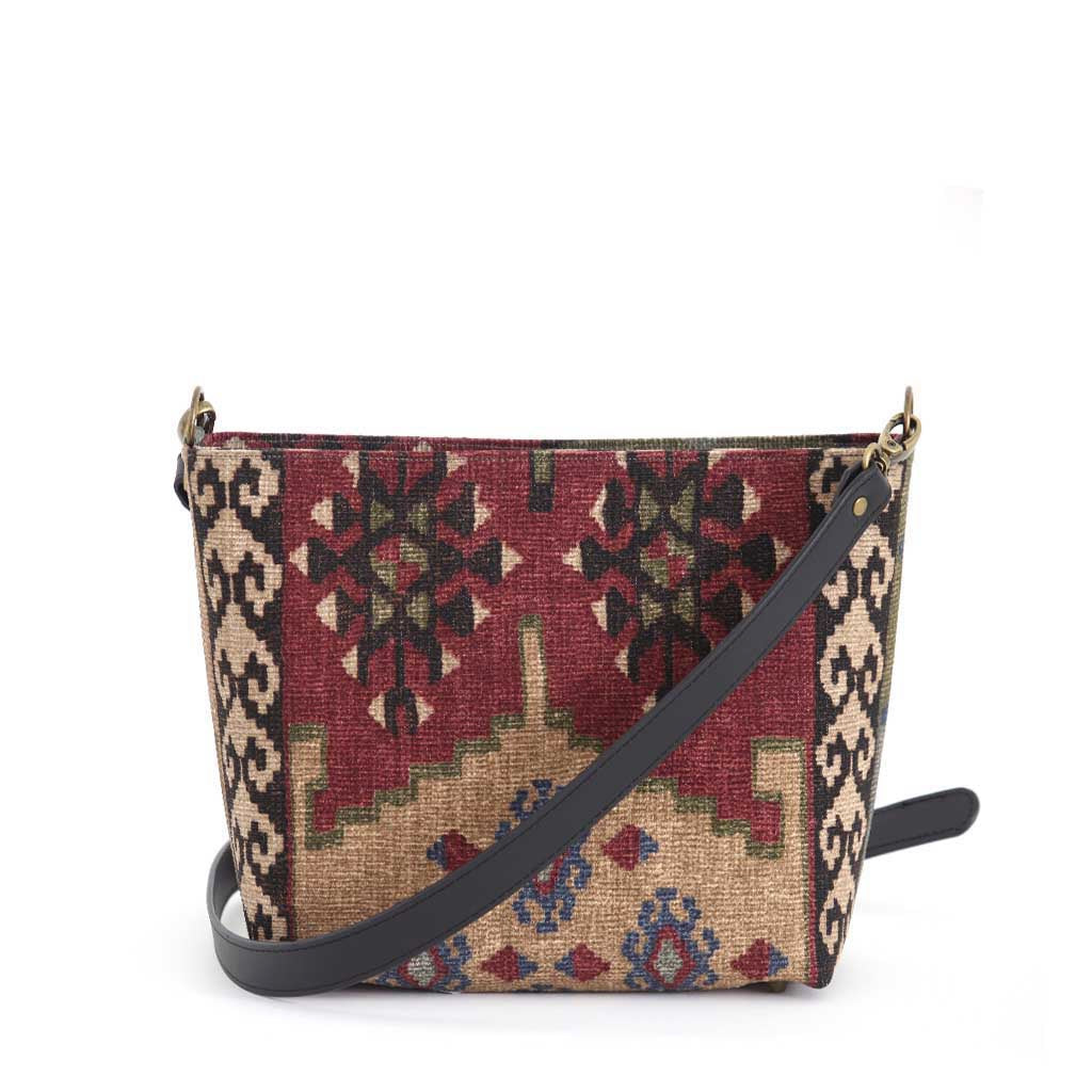 The back view of Kilim canvas crossbody bag with green and wine geometric pattern handmade in Great Britain by Umpie Handbags