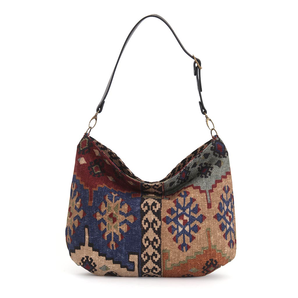 The front view of the Artisan Kilim Canvas Hobo Bag with a black leather strap, by Umpie Handbags
