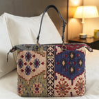 Canvas Weekend Bag in Kilim design styled in a hotel room setting, blending Turkish textile heritage with British craftsmanship by Umpie Handbags
