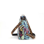 Side and back view of Tropical Tapestry Crossbody Bag on white background showing compact silhouette, antique gold hardware and leopard print leather strap, by Umpie Handbags