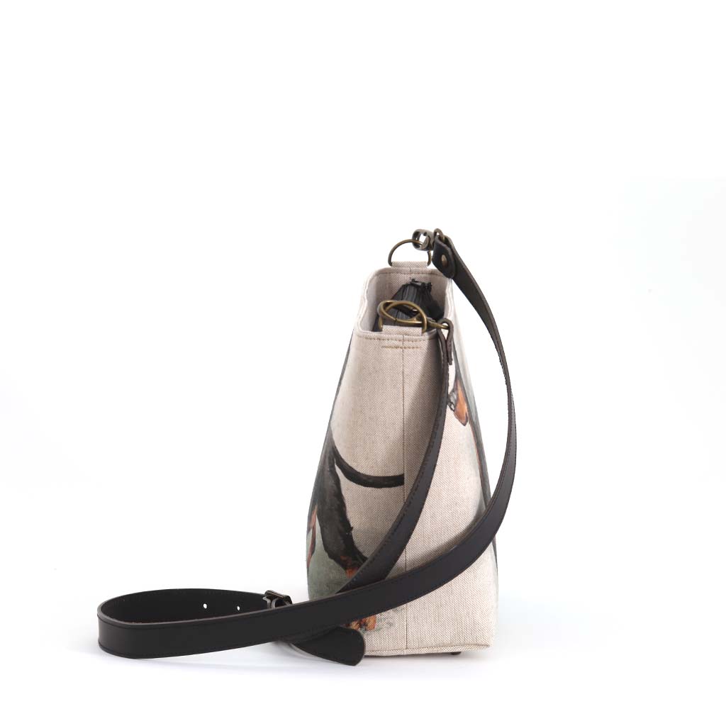 The Dachshund Crossbody Bag with a black leather strap by Umpie Handbags - side view