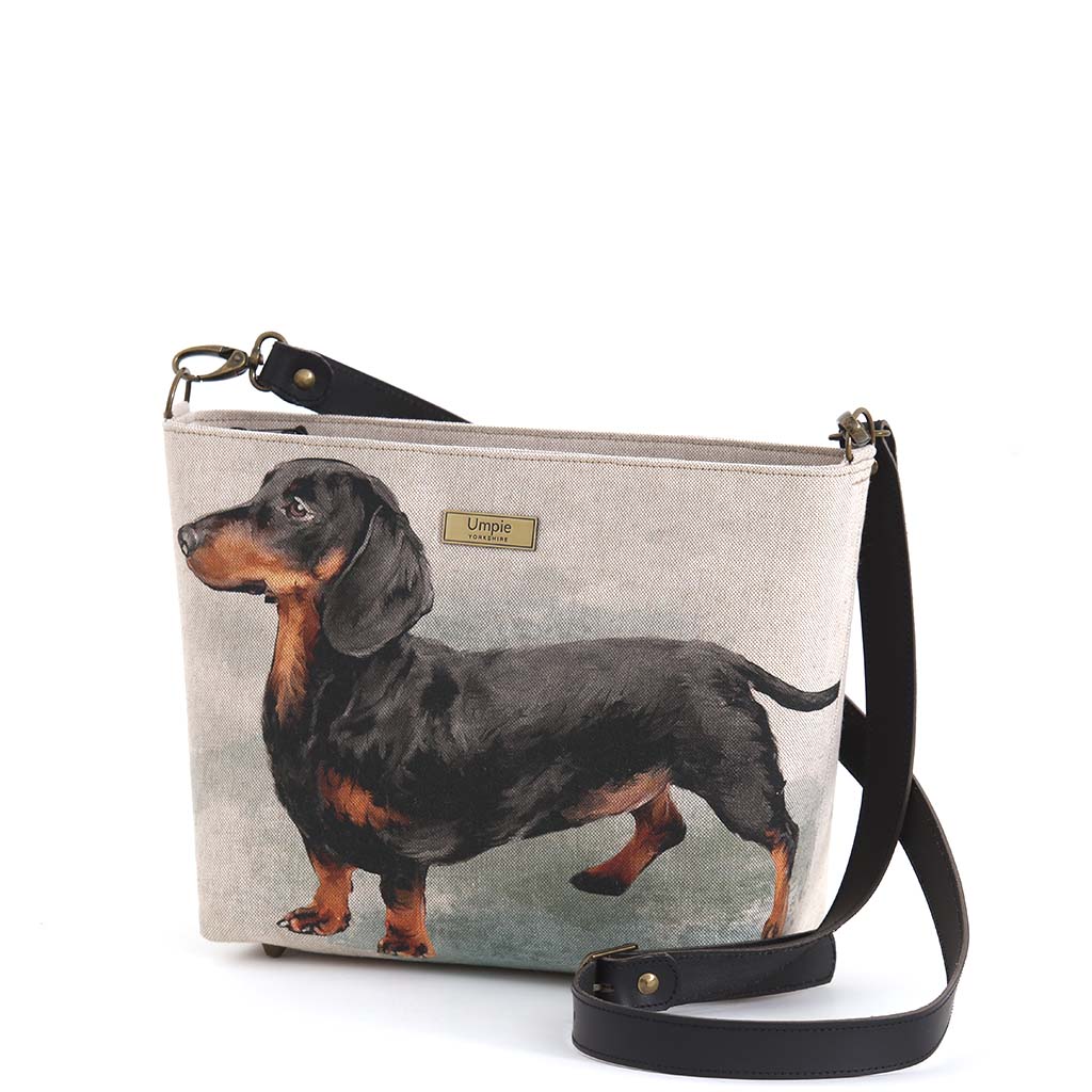 The Dachshund Crossbody Bag with a black leather strap by Umpie Handbags