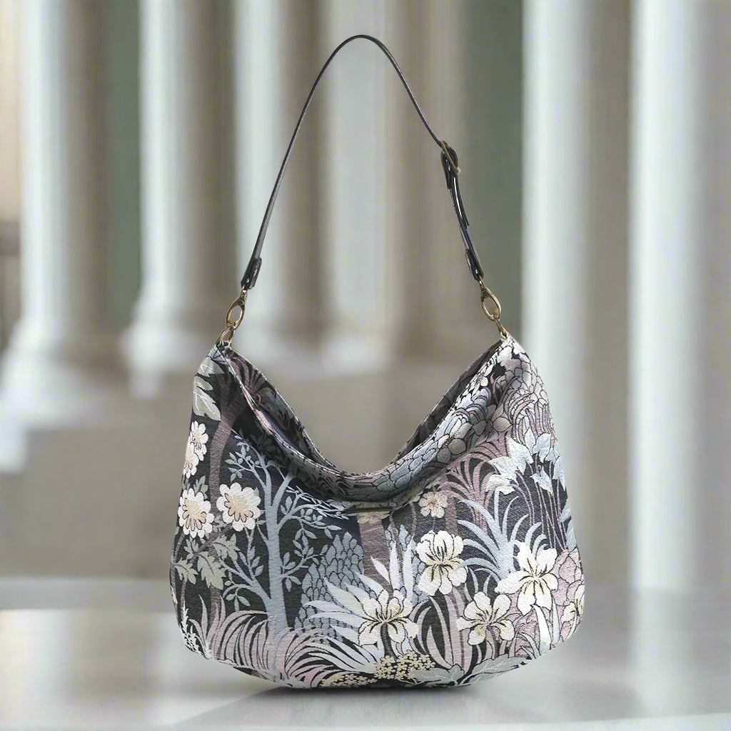The Grey Floral Hobo Bag with a black leather strap