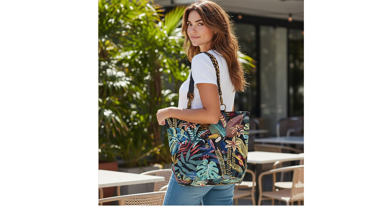 Floral tote bag featuring vibrant tropical botanical print in lush greens, coral pinks, and warm yellows with bold leopard print leather straps, showcasing spacious everyday design and exotic pattern mixing by Umpie Handbags