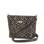 Gold metallic crossbody bag displayed at three-quarter angle, highlighting the premium black leather adjustable strap, fully lined interior with zip-top closure, and elegant proportions of handcrafted design by Umpie Handbags