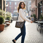 Luxurious gold metallic crossbody bag with black leather shoulder strap featuring geometric print detailing, rich shimmering finish, structured compact silhouette, adjustable strap with distinctive pattern, premium craftsmanship, by Umpie Handbags