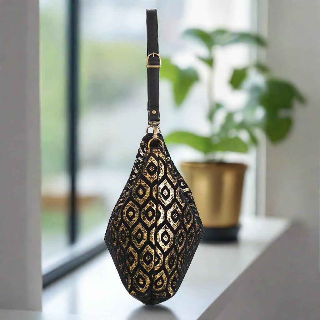 Glamorous Gold Metallic Hobo Bag side profile - show-stopping British-made accessory with supple black leather strap detail  by Umpie Handbags