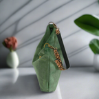 Green velvet hobo bag showing spacious zip-top opening with leopard print leather strap and premium craftsmanship details by Umpie Handbags