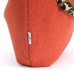 The Orange Harris Tweed Hobo Bag with a Leopard leather strap - close up view