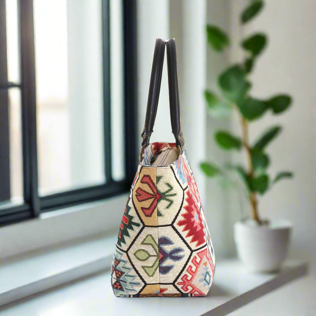  Hexagon handbag with multicoloured tapestry fabric and black leather handles - side view by Umpie Handbags

