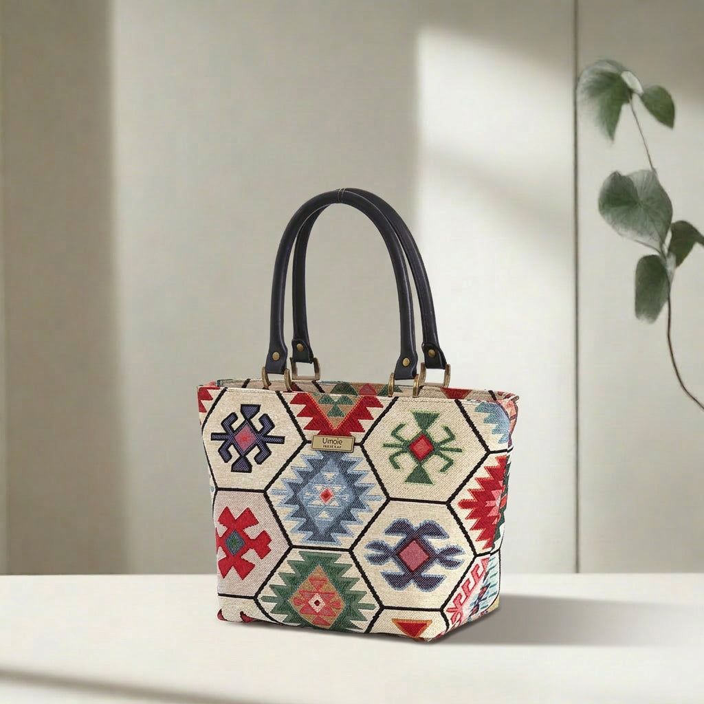 Hexagon handbag with multicoloured tapestry fabric and black leather handles by Umpie Handbags