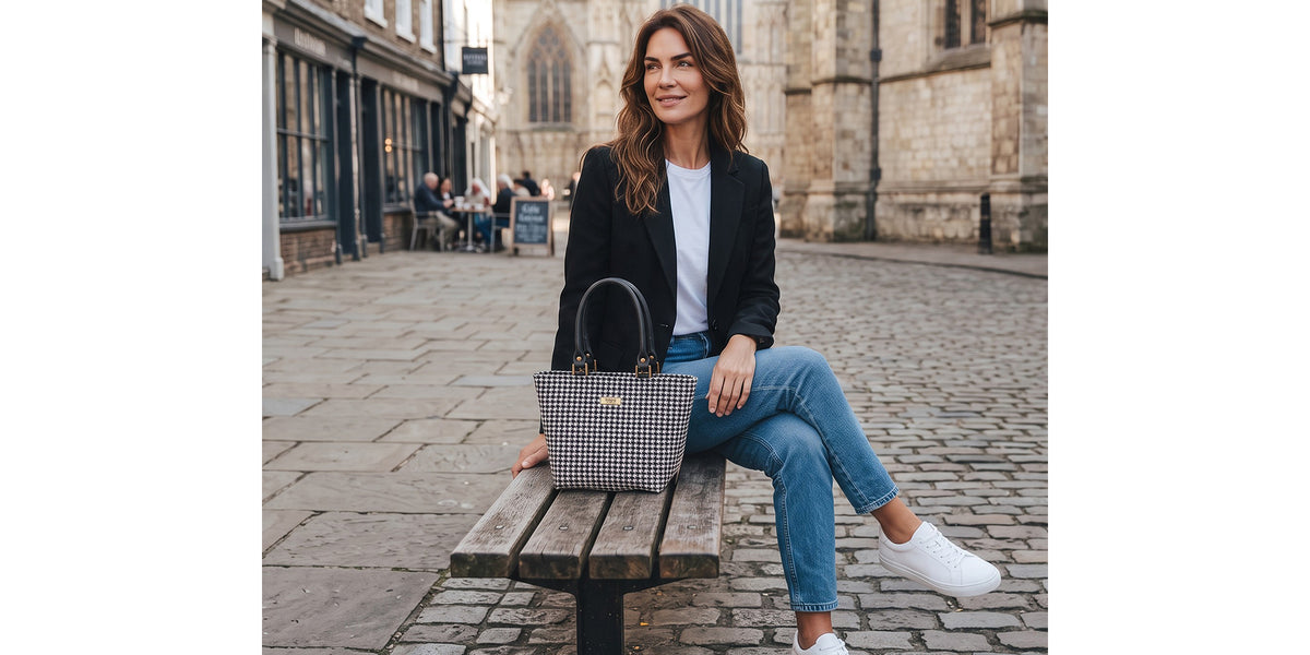 A women sitting outside York Minster with the Harris Tweed Houndstooth Handbag by Umpie Yorkshire