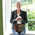 Woman holding the Canvas Handbag, Kilim design with black leather handles by Umpie Handbags