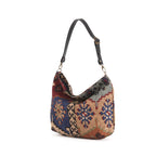 Kilim Canvas Hobo Bag worn over shoulder showing navy mix geometric patterns and relaxed silhouette by Umpie Handbags