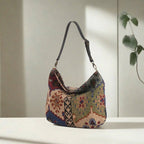 Kilim Canvas Hobo Bag worn over shoulder showing green mix geometric patterns and relaxed silhouette by Umpie Handbags