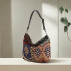 Kilim Canvas Hobo Bag worn over shoulder showing navy mix geometric patterns and relaxed silhouette by Umpie Handbags