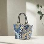Navy canvas handbag with traditional Kilim geometric pattern in navy, grey, light blue and taupe, brown leather handles, front view by Umpie Handbags