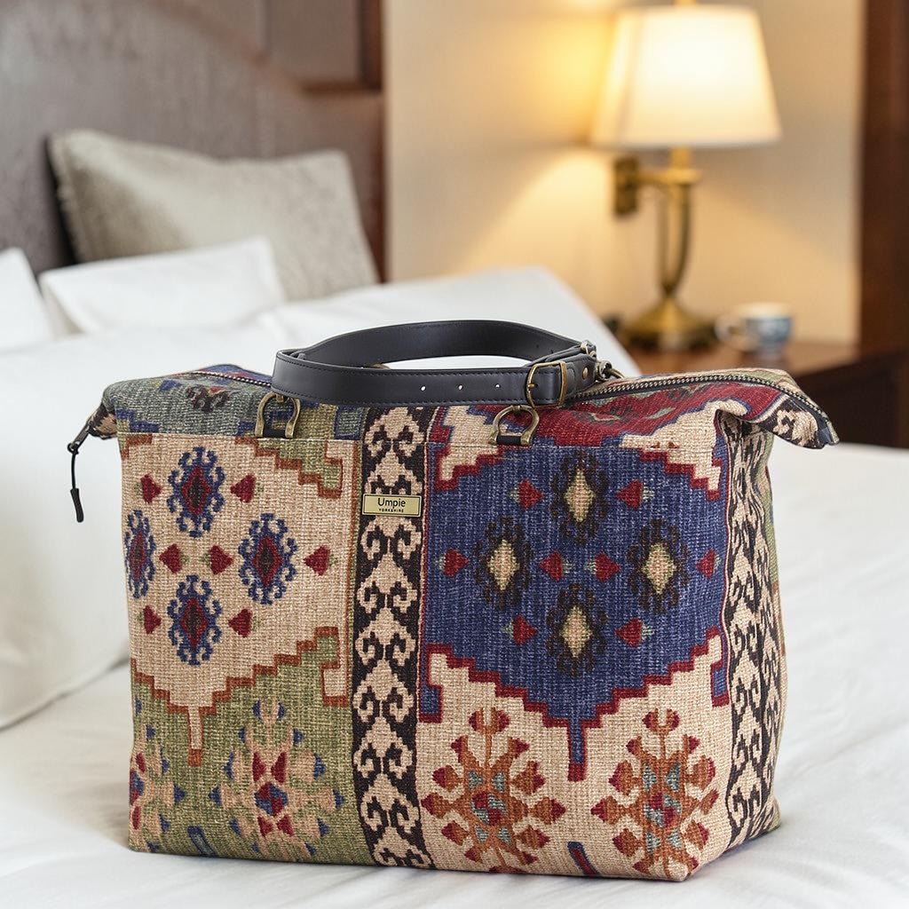 Canvas Kilim Weekend Bag resting in a hotel room, showcasing heritage geometric print and spacious design by Umpie Handbags