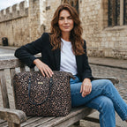 Model in York with the Metallic Leopard Print Overnight Bag by Umpie Handbags