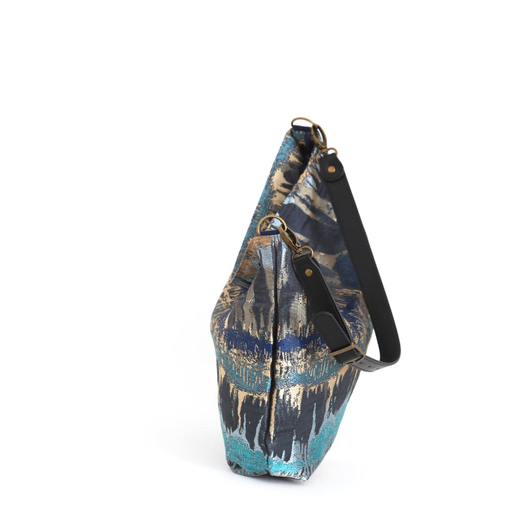 Top zip detail of Teal Metallic Hobo Bag revealing spacious interior and secure closure by Umpie Handbags