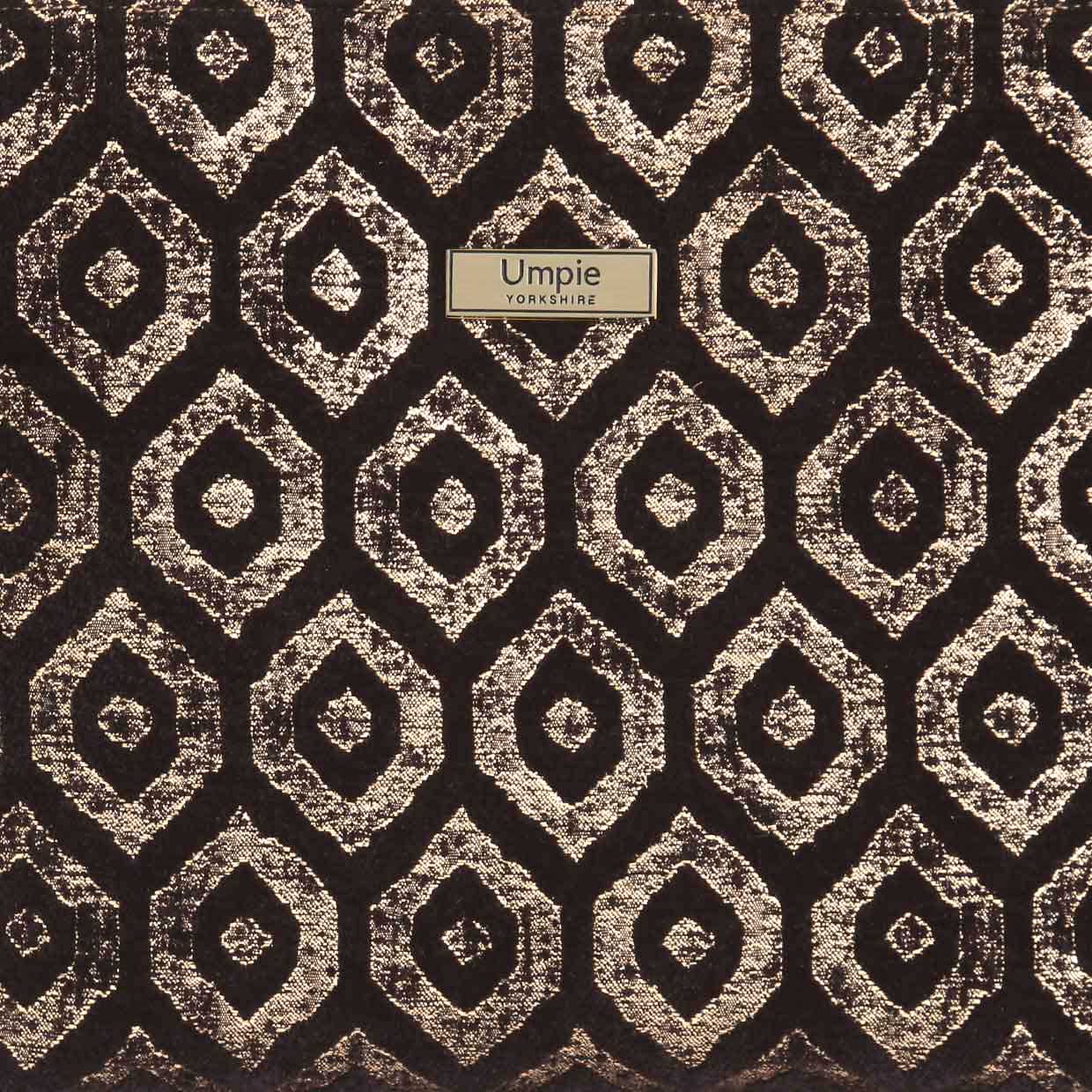 Close-up detail of gold metallic fabric crossbody bag showing the rich textured surface that catches light beautifully, firm construction quality, and sophisticated craftsmanship of Yorkshire-made accessory by Umpie Handbags