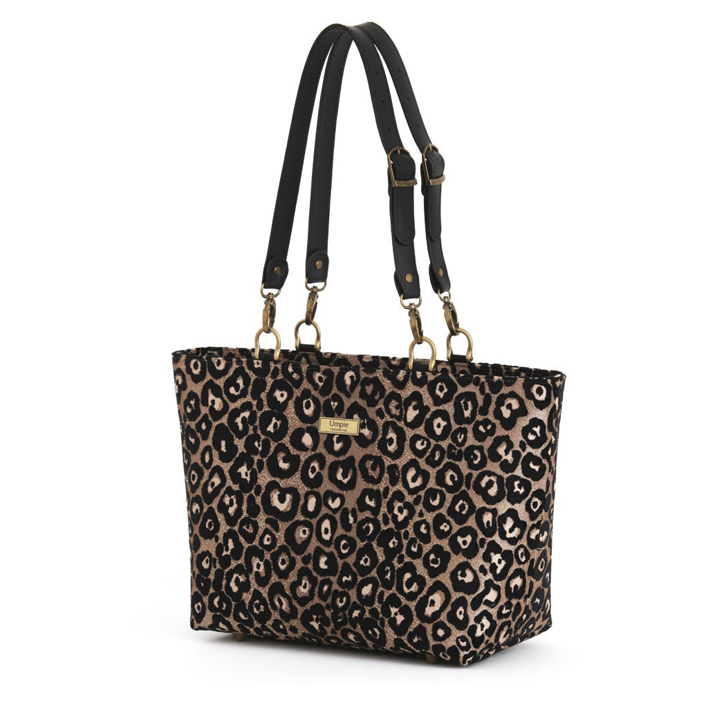 Spacious leopard print shoulder bag with shimmering metallic finish, smooth black leather double straps, and secure zip closure by Umpie Handbags
