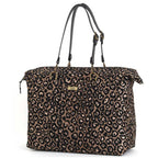 Handmade metallic leopard print weekend bag showing secure zip-top closure and stitched leather straps by Umpie Handbags