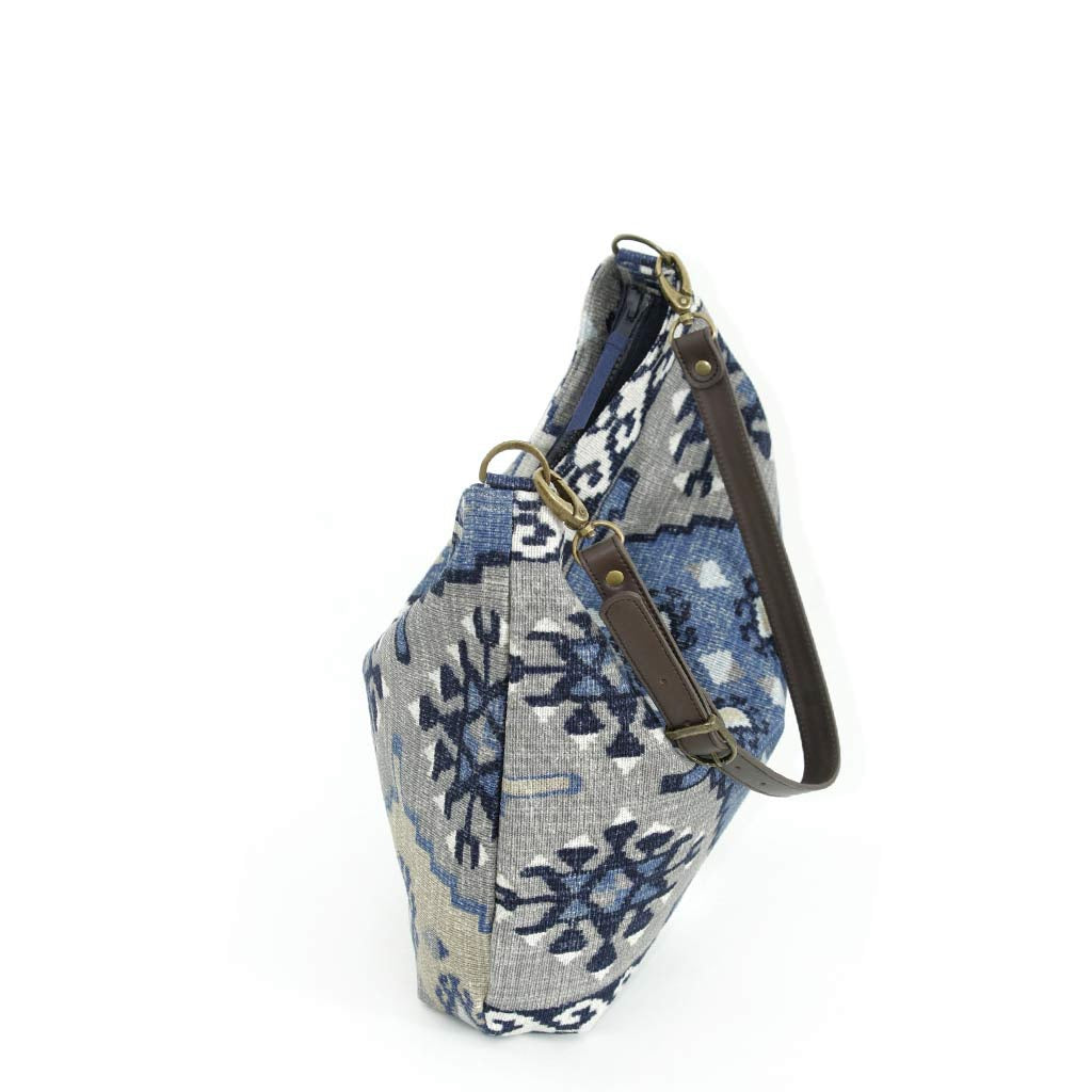 The zip-top view of the Artisan Navy Kilim Canvas Hobo Bag with a brown leather strap by Umpie Handbags