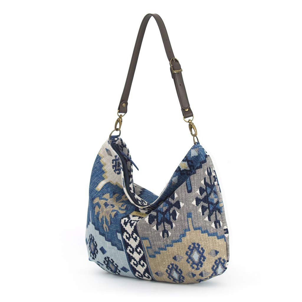 The front view of the Artisan Navy Kilim Canvas Hobo Bag with a brown leather strap by Umpie Handbags