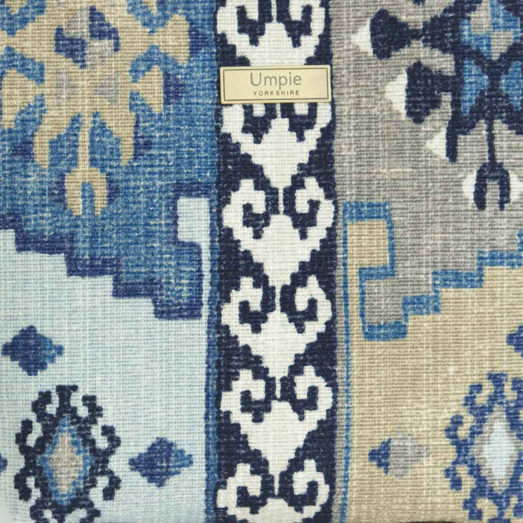 Fabric view of the Navy canvas handbag with traditional Kilim geometric pattern in navy, grey, light blue and taupe, beige leather handles, front view by Umpie Handbags