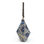 The side view of the Artisan Navy Kilim Canvas Hobo Bag with a brown leather strap by Umpie Handbags