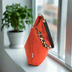 The Orange Harris Tweed Hobo Bag with a Leopard print leather strap - top zip view